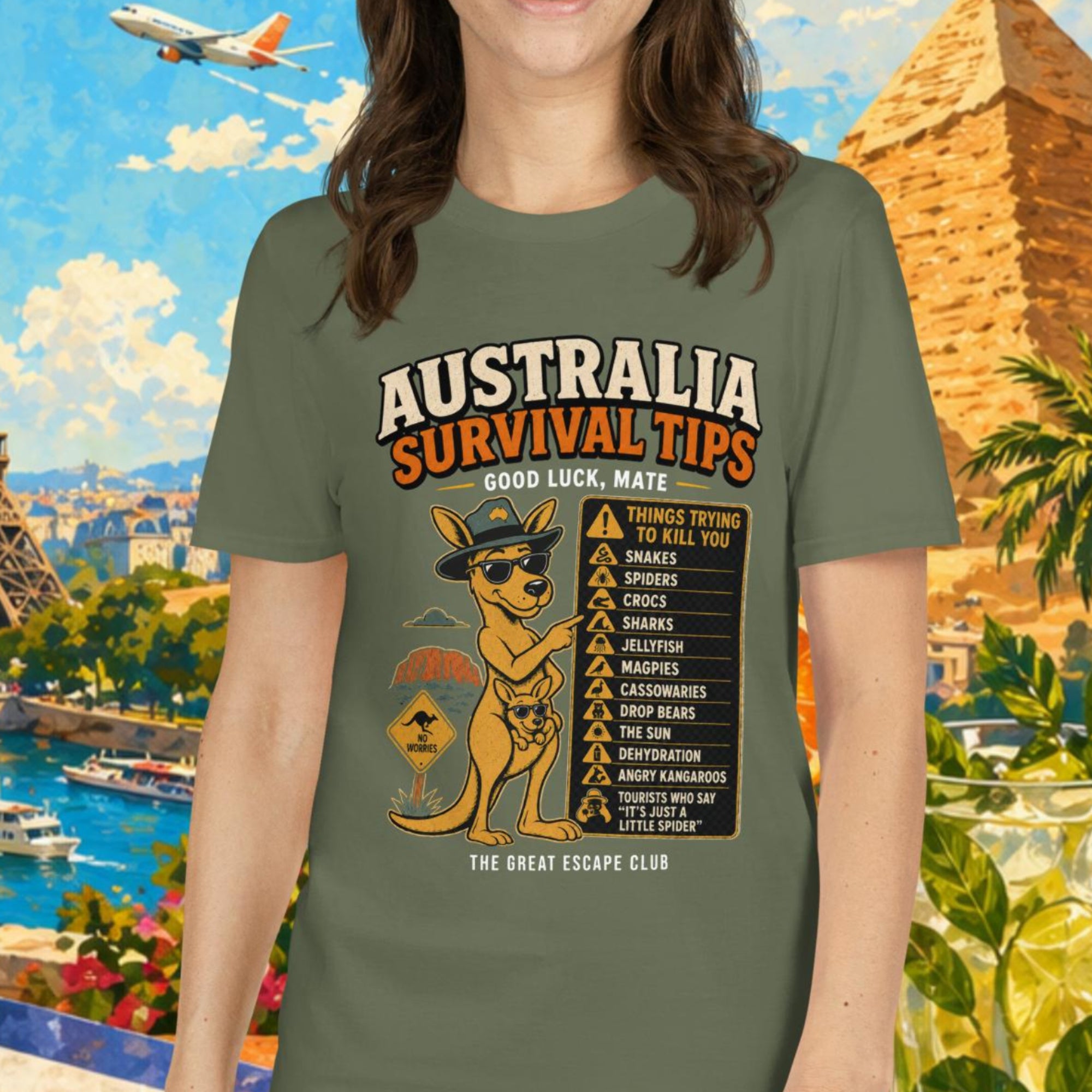 Woman wearing a t-shirt with 'Australia Survival Tips' design, surrounded by travel-themed elements like Eiffel Tower and pyramids.