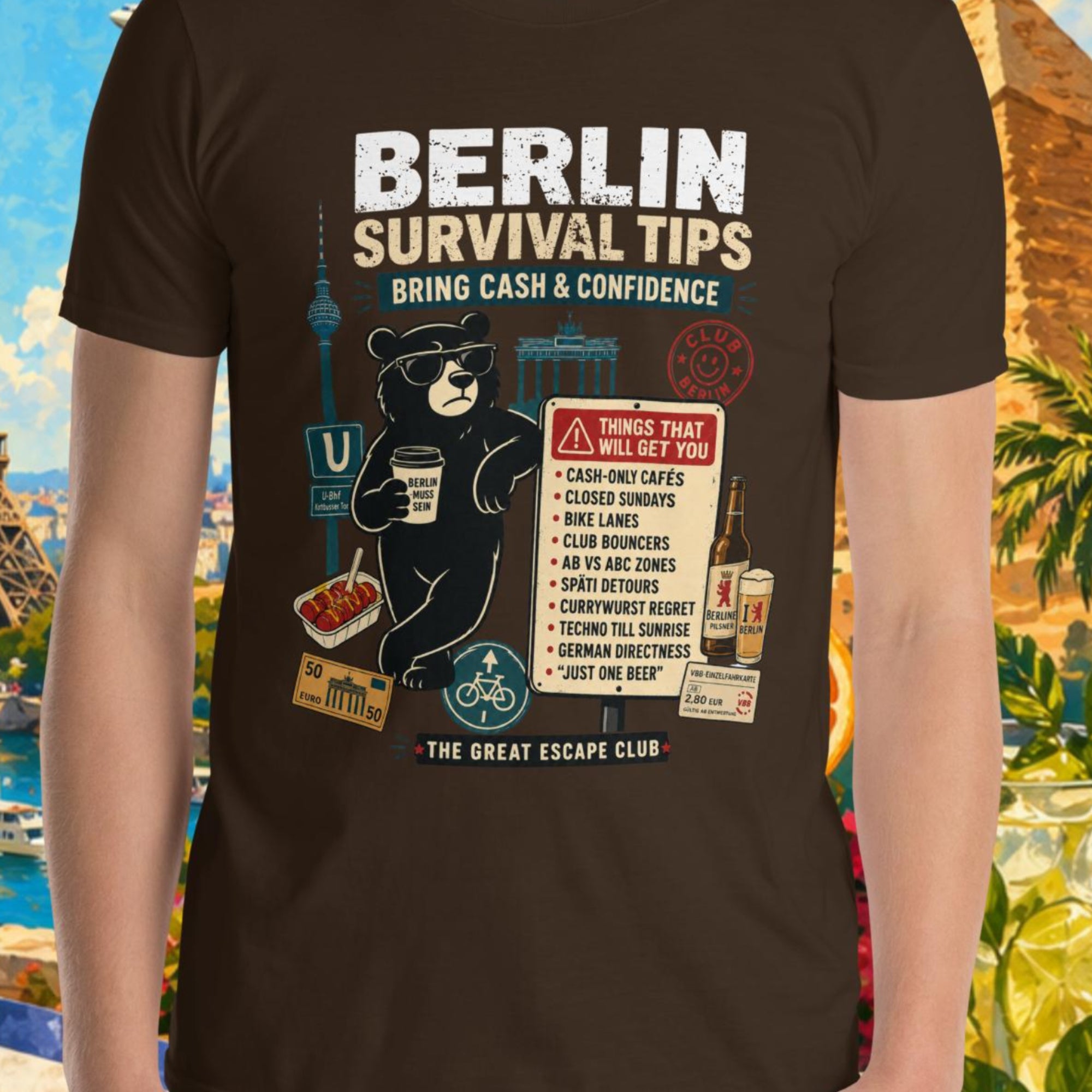 Person wearing a t-shirt with 'Berlin Survival Tips' design in front of a colorful background with landmarks and nature.