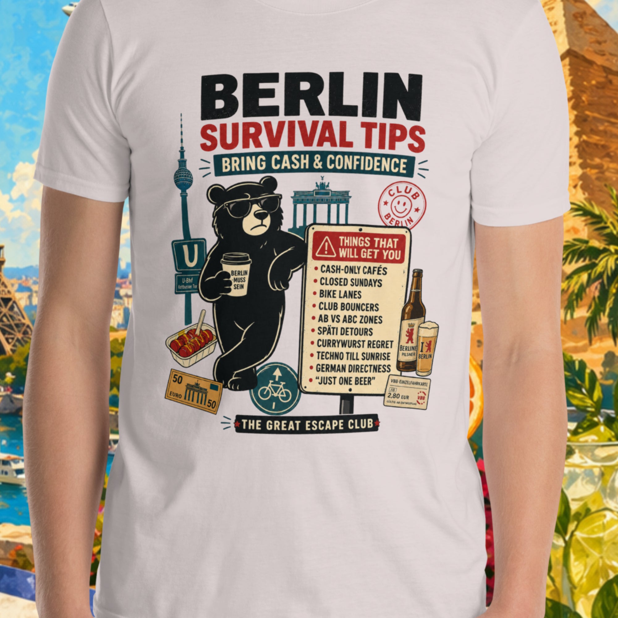 Person wearing a t-shirt with 'Berlin Survival Tips' graphic in front of a colorful background with landmarks and nature.