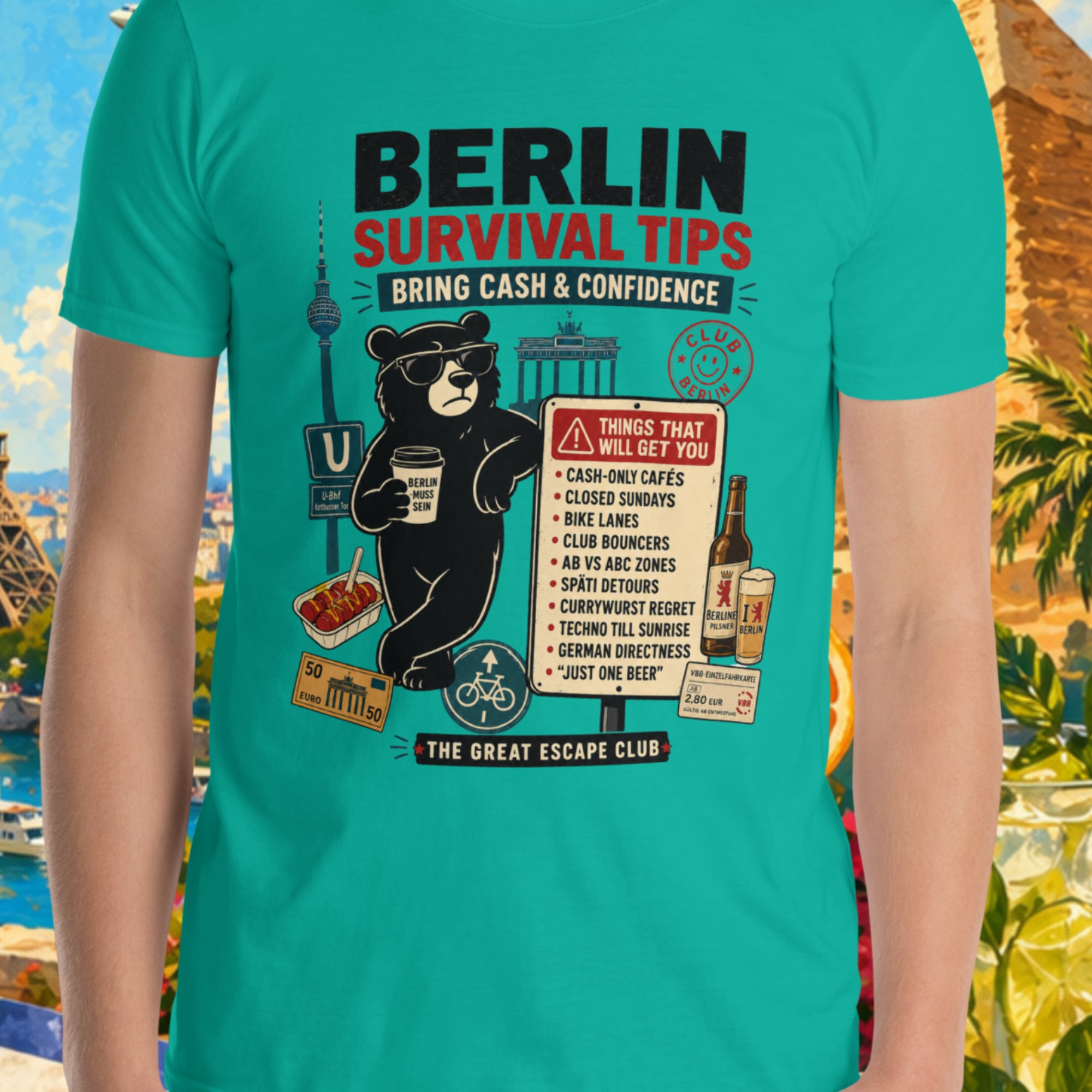Person wearing a teal t-shirt with 'Berlin Survival Tips' graphic in front of a colorful background with landmarks and nature.
