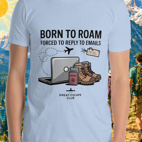 Born to Roam Forced to Reply to Emails unisex light blue T-shirt with laptop, hiking boots, passport and airplane travel design