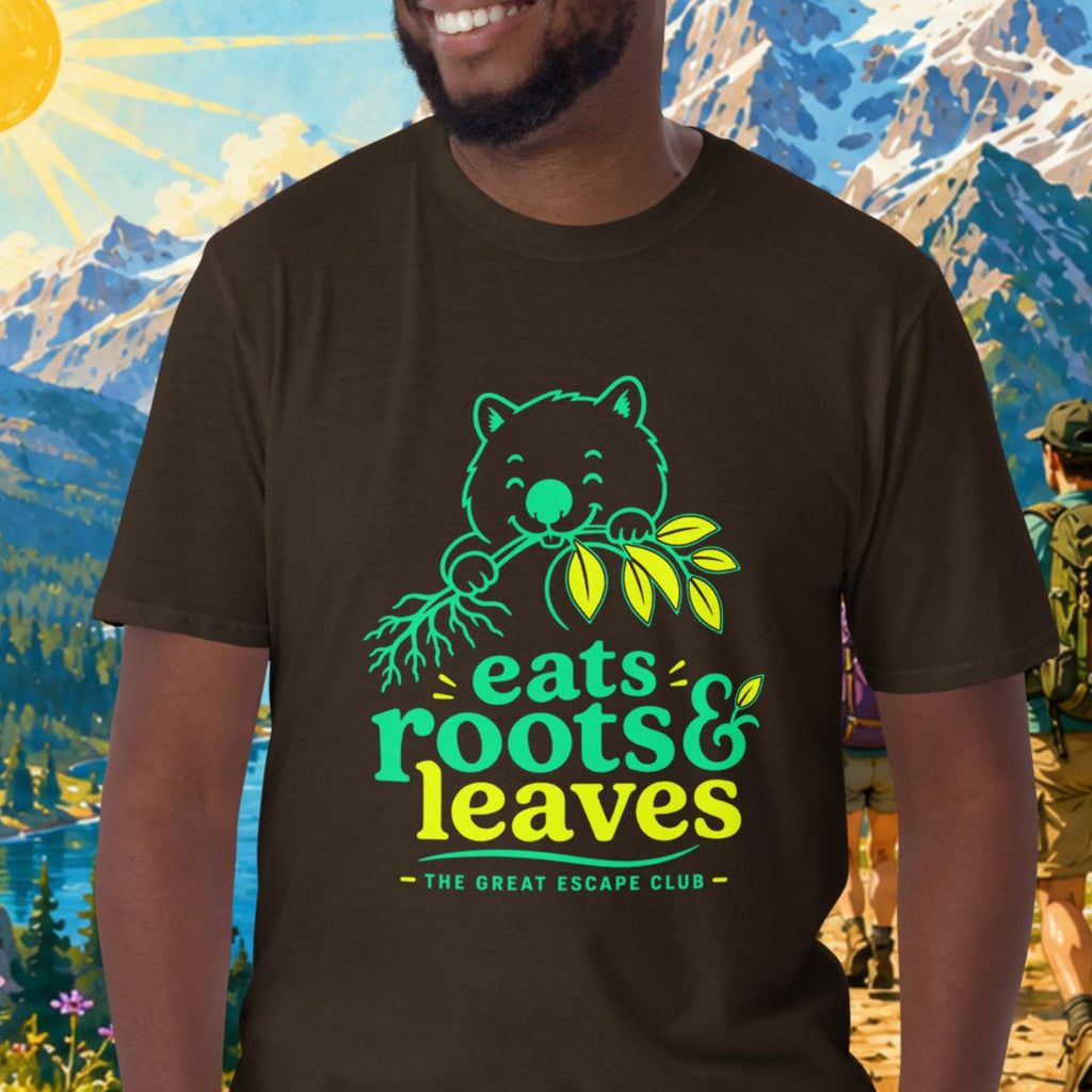 Man wearing a t-shirt with a nature-themed design in front of a mountainous landscape.