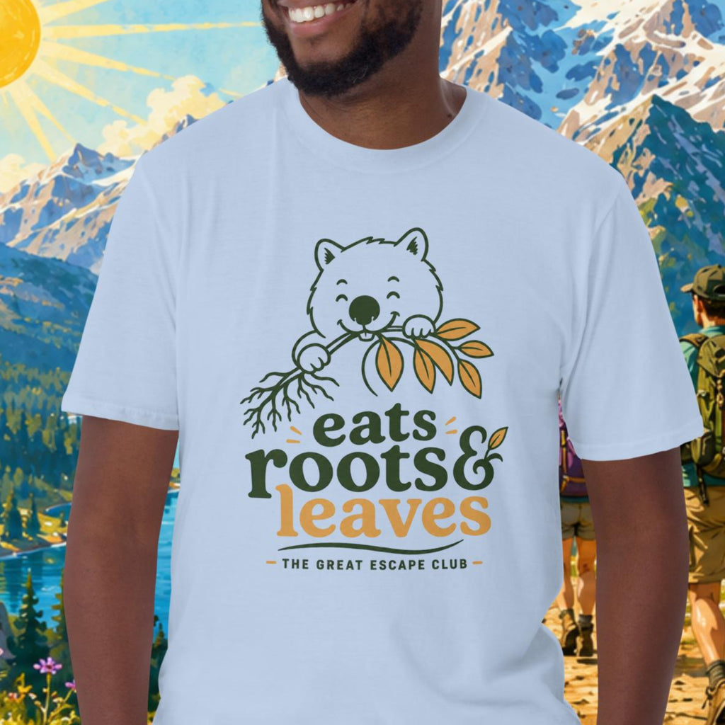 Man wearing a t-shirt with a bear graphic and text in a mountainous landscape