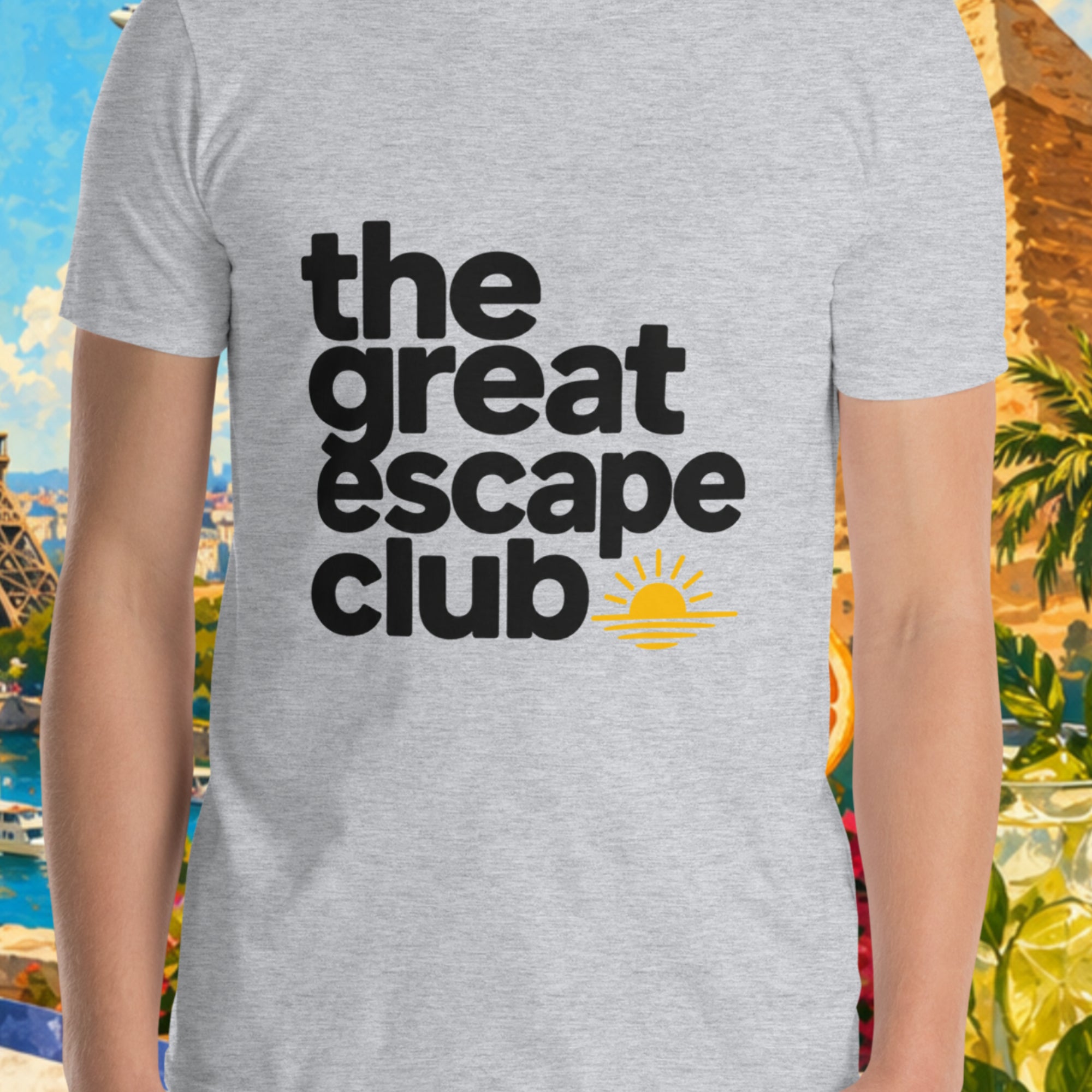 Person wearing a 'the great escape club' t-shirt with a colorful background featuring the Eiffel Tower and pyramids.