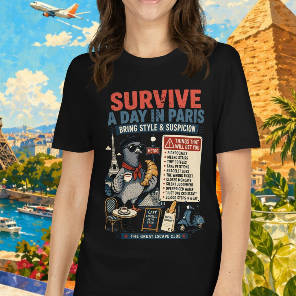 Survive a Day in Paris unisex T-shirt in Black featuring a funny Paris pigeon travel graphic with croissant, espresso and warning sign design.