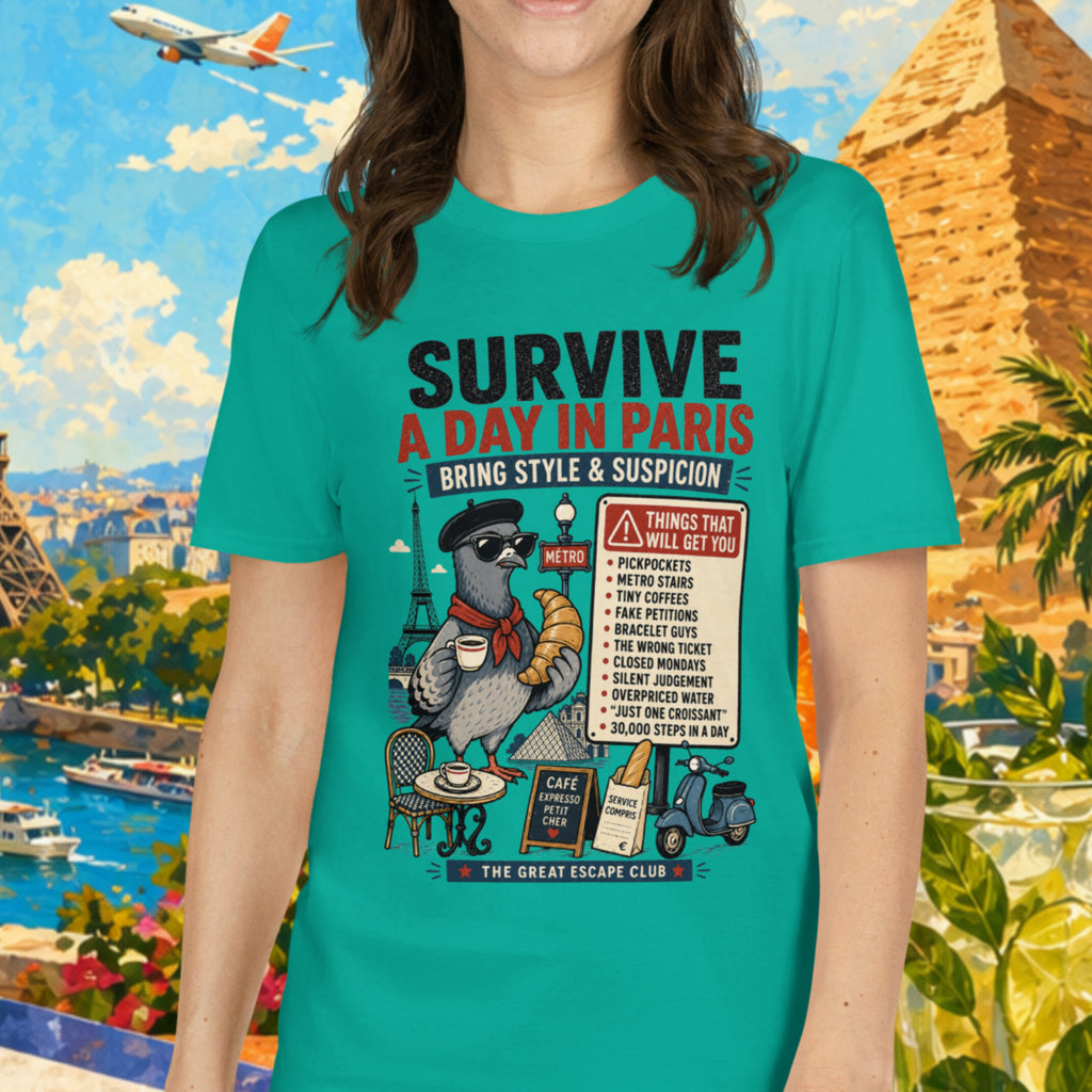 Woman wearing a teal t-shirt with a graphic design in front of a colorful background with landmarks and tropical elements.