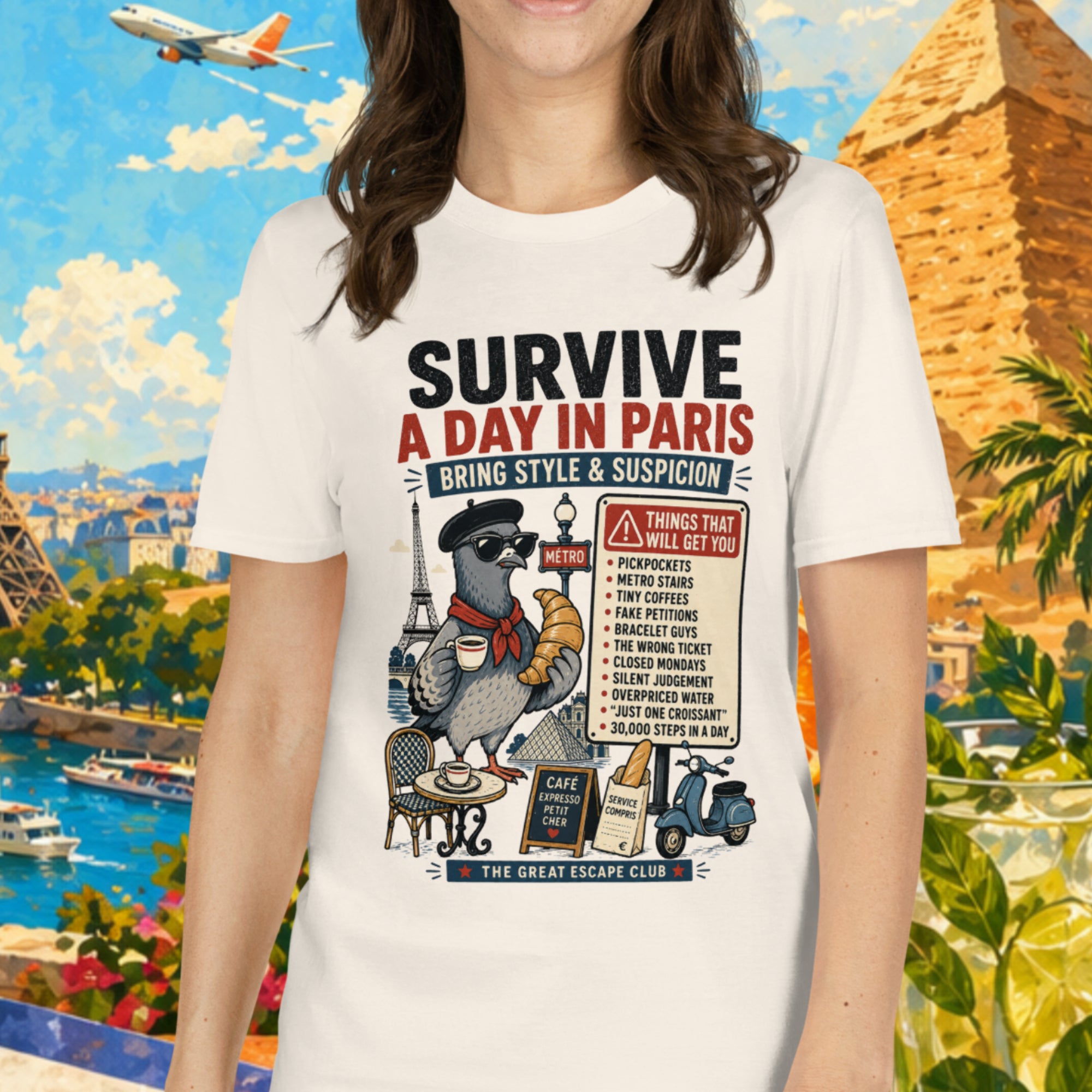 Person wearing a t-shirt with travel-themed design in front of a scenic background