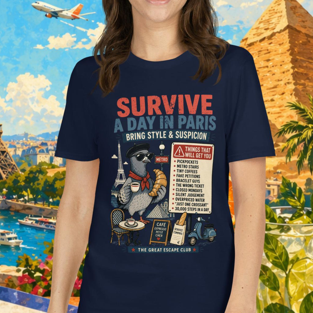 Survive a Day in Paris unisex T-shirt in navy featuring a funny Paris pigeon travel graphic with croissant, espresso and warning sign design.
