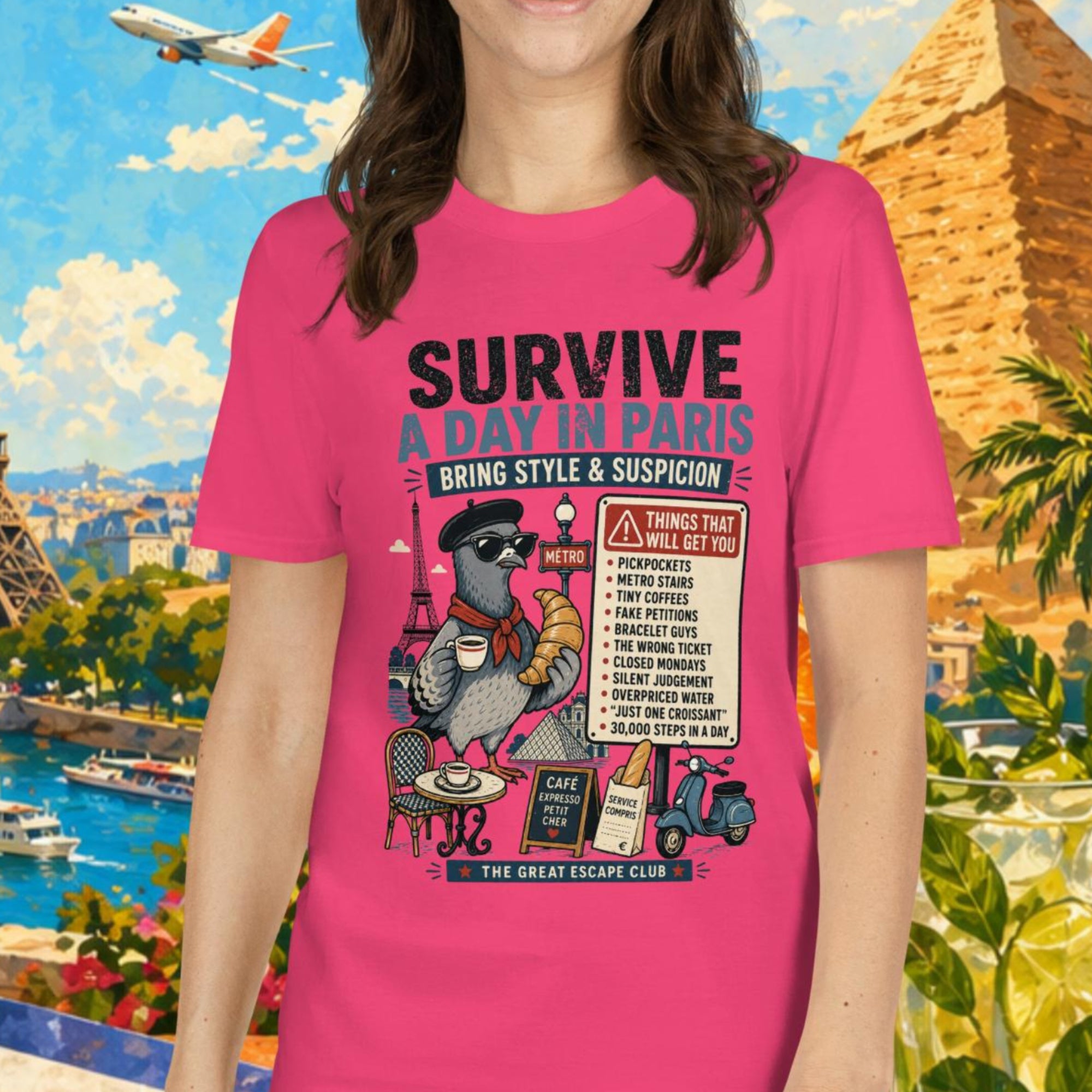 Survive a Day in Paris unisex T-shirt in pink featuring a funny Paris pigeon travel graphic with croissant, espresso and warning sign design.