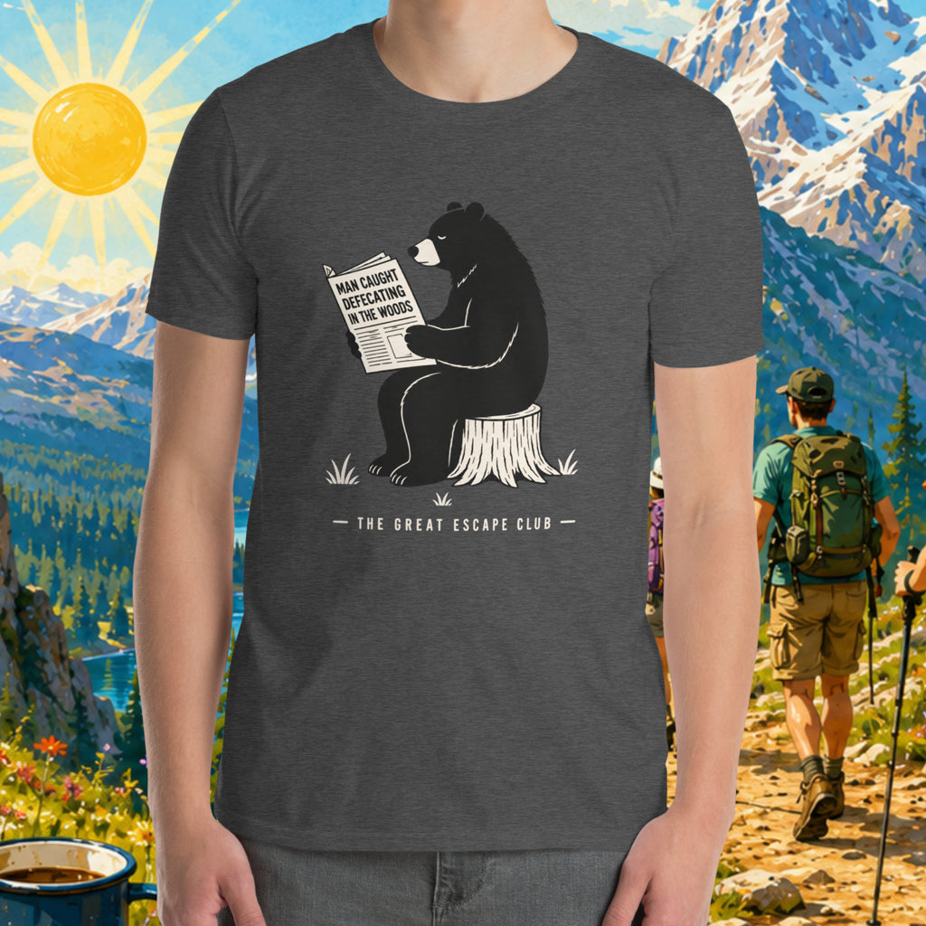 Person wearing a t-shirt with a bear graphic and text, set against a scenic mountain backdrop.