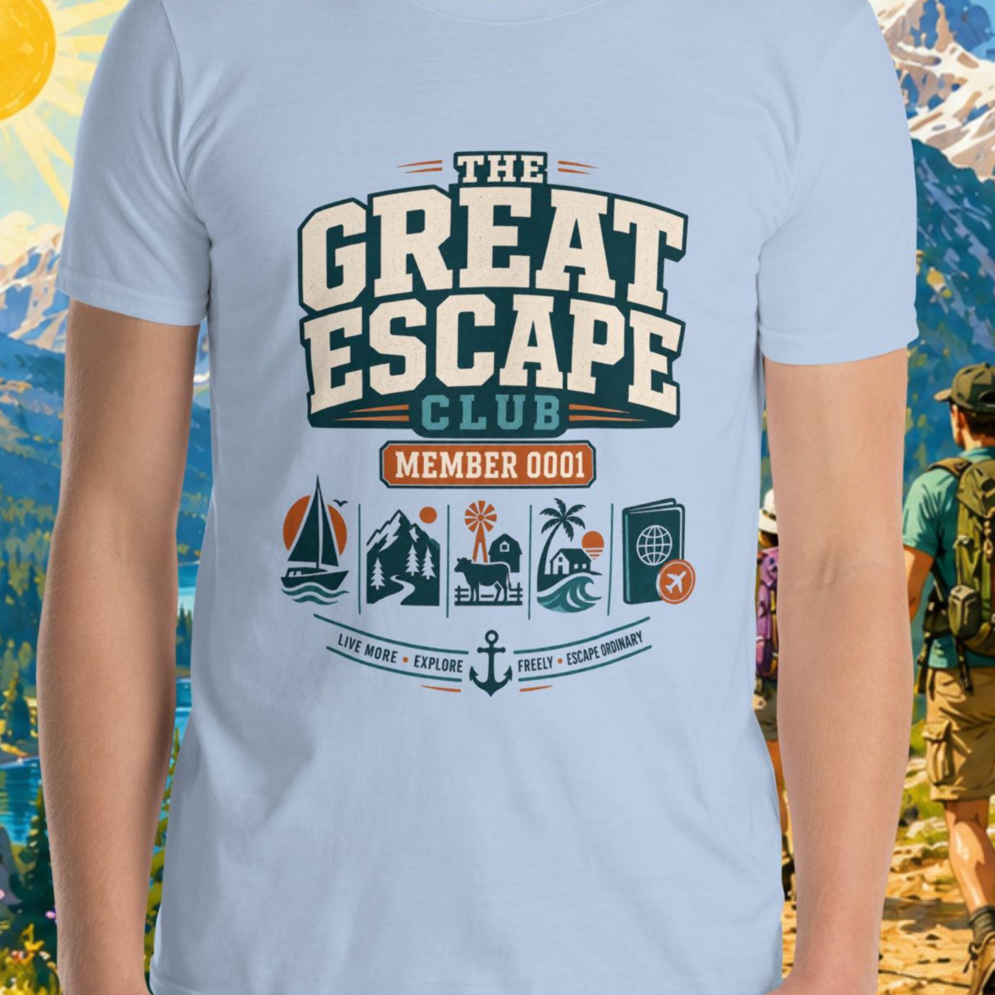 Person wearing a t-shirt with 'The Great Escape Club' design against a scenic mountain backdrop