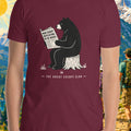 Maroon t-shirt with bear graphic and text 'The Great Escape Club' against a nature-themed background.