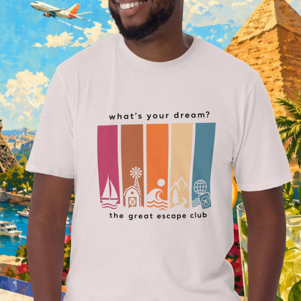 Man wearing a t-shirt with travel-themed design in front of a colorful background with landmarks and travel items.