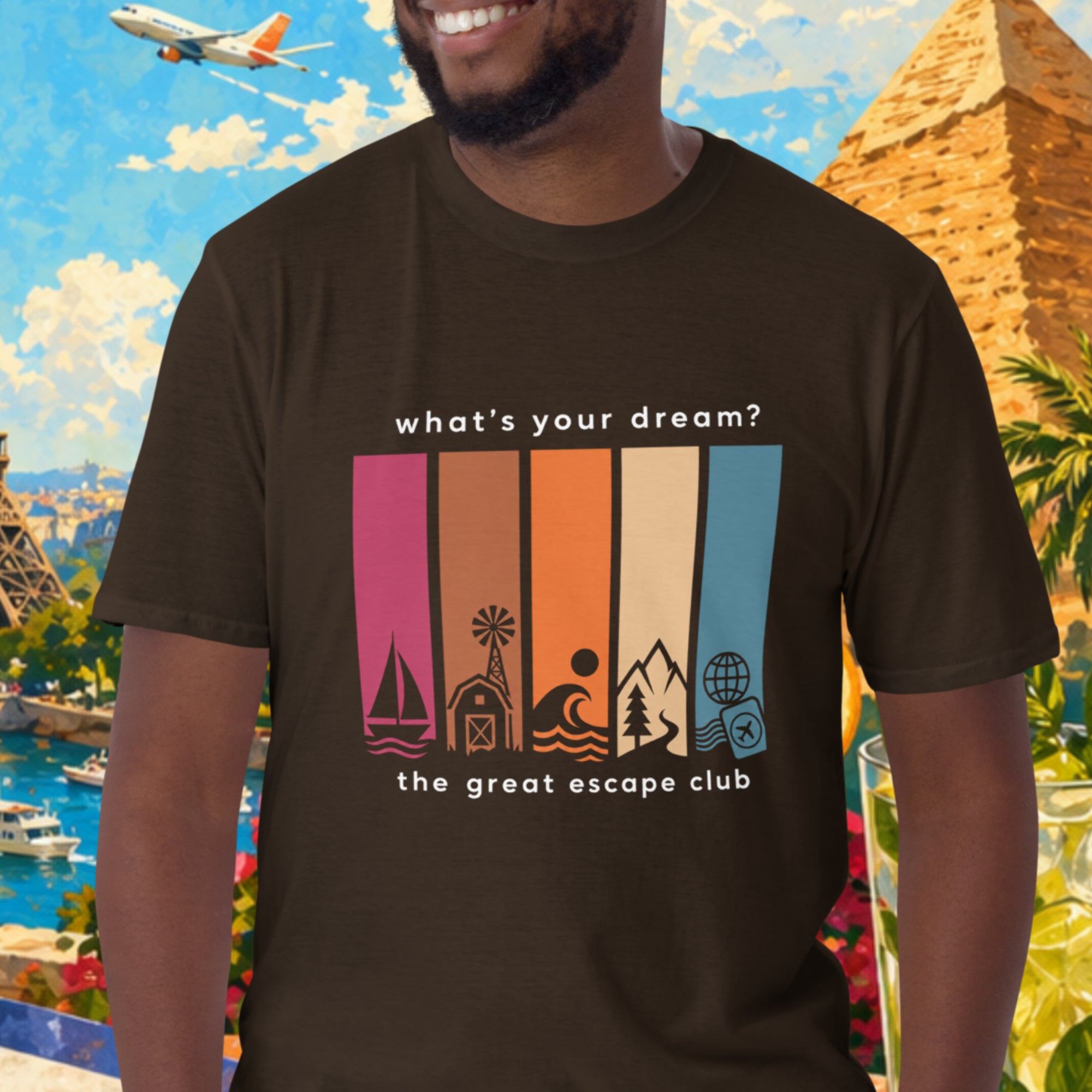 Man wearing a t-shirt with travel-themed design in front of a colorful background with landmarks and nature.