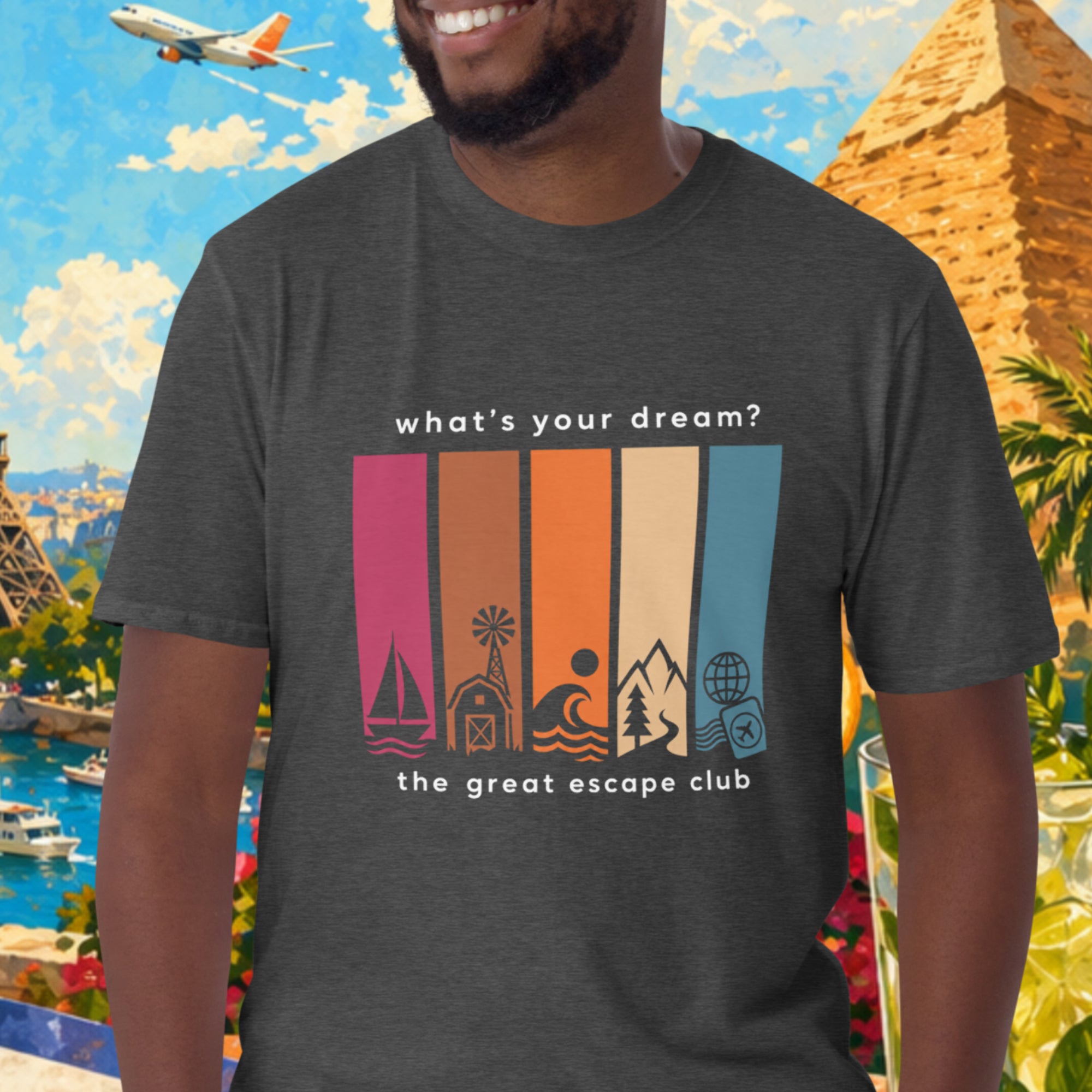 Man wearing a t-shirt with travel-themed design in front of a colorful background with landmarks and nature.