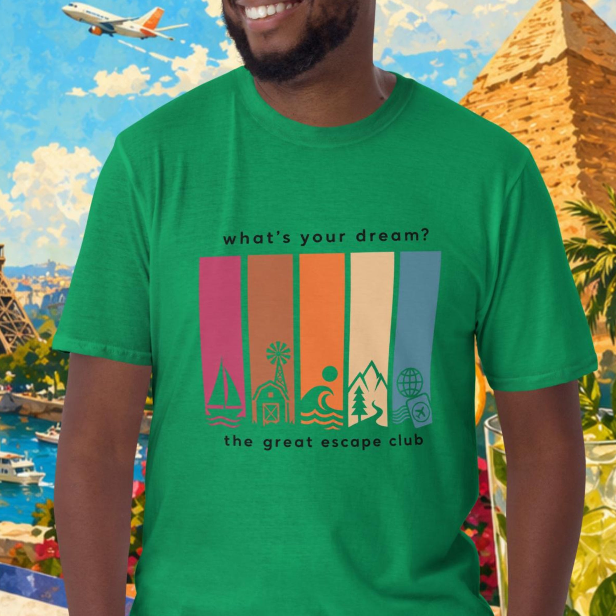 Man wearing a green t-shirt with a colorful graphic design in front of a scenic background with Eiffel Tower, pyramids, and tropical elements.