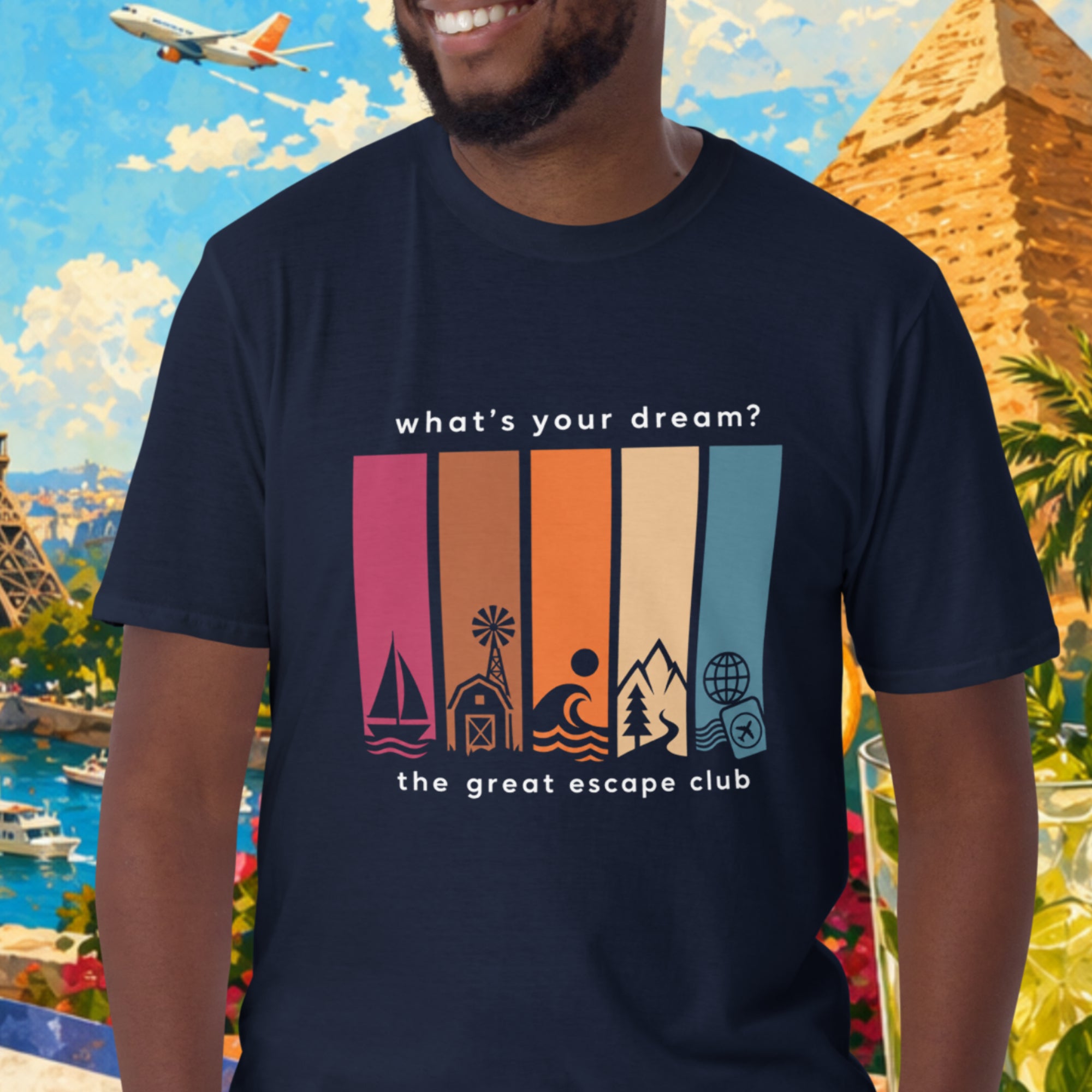 Man wearing a t-shirt with travel-themed design in front of a colorful background with landmarks and nature.