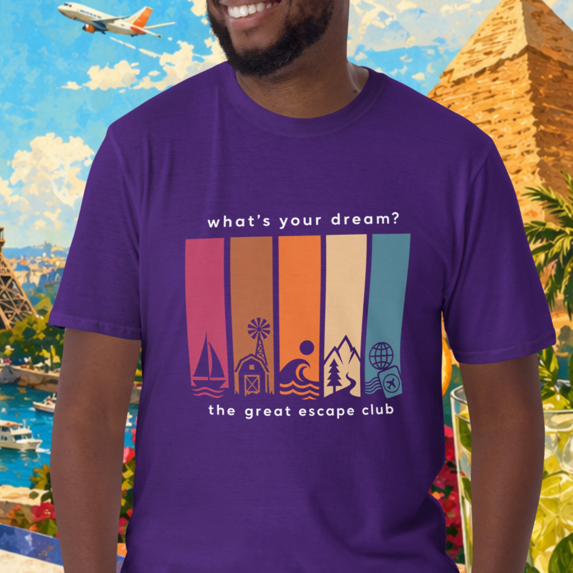 Man wearing a purple t-shirt with a travel-themed design in front of a colorful background with landmarks and nature.
